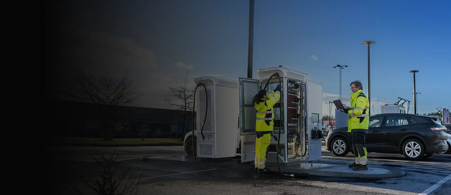 ABB E-mobility contractors servicing a customer's EV charger on site