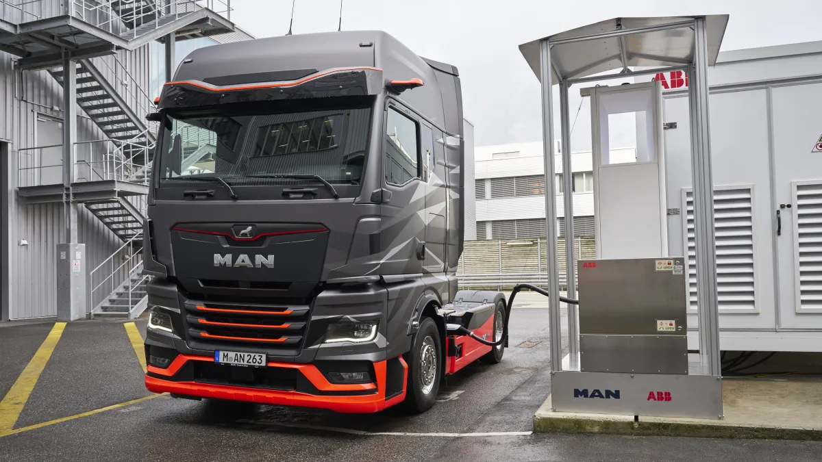 The picture shows an MAN eTruck charging at a proof of concept charger of ABB E-mobility