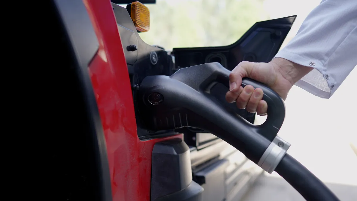 A person connecting an MCS to an MAN e-truck during the test week at ABB E-mobility