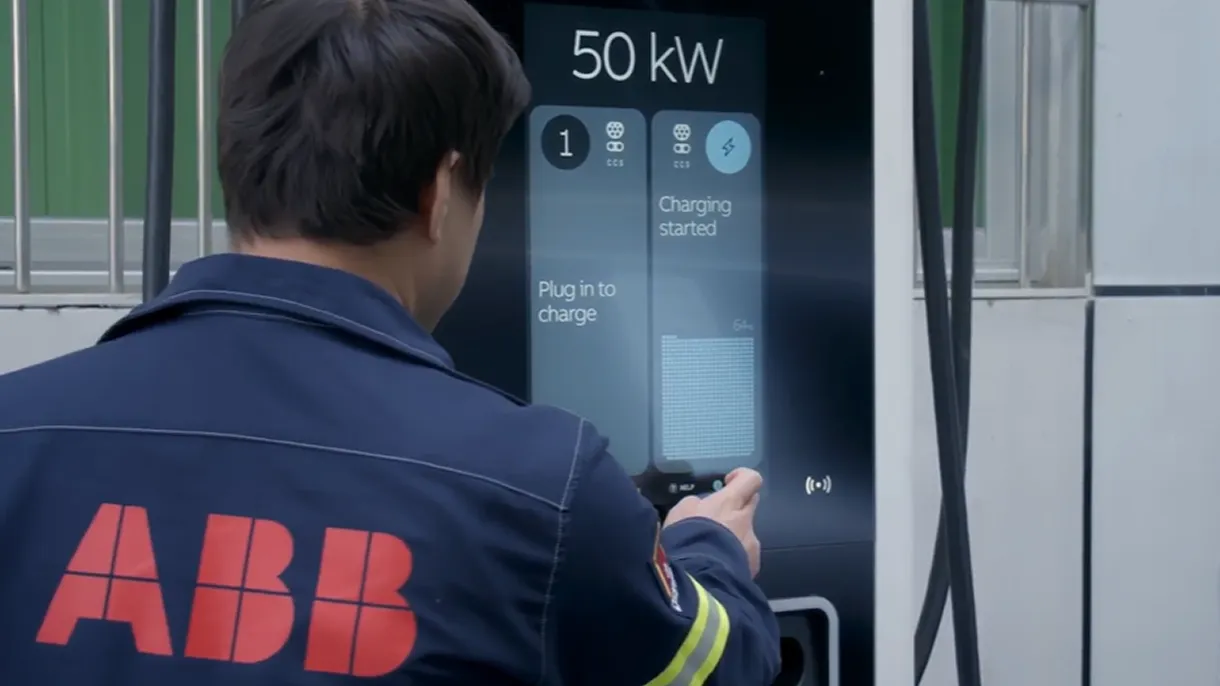 ABB E-mobility engineer interacting with a C50 charger interface